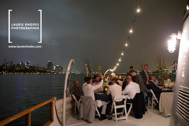 Wedding photo by Laurie Rhodes, on on a boat overlooking Manhattan - 3